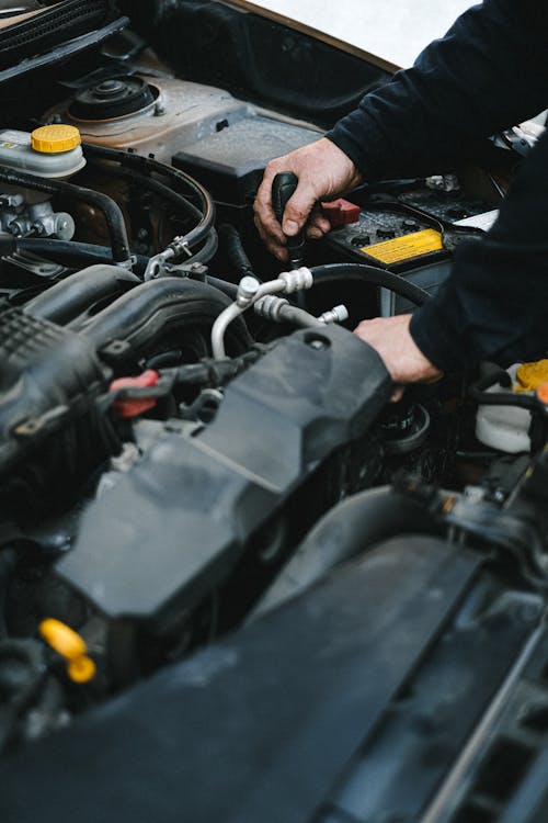 Engine bay during car battery replacement and inspection service in Oklahoma City