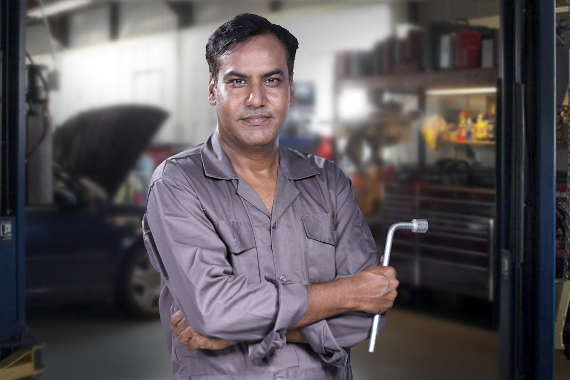 Professional mobile mechanic holding wrench ready for on-site auto repair in Oklahoma City