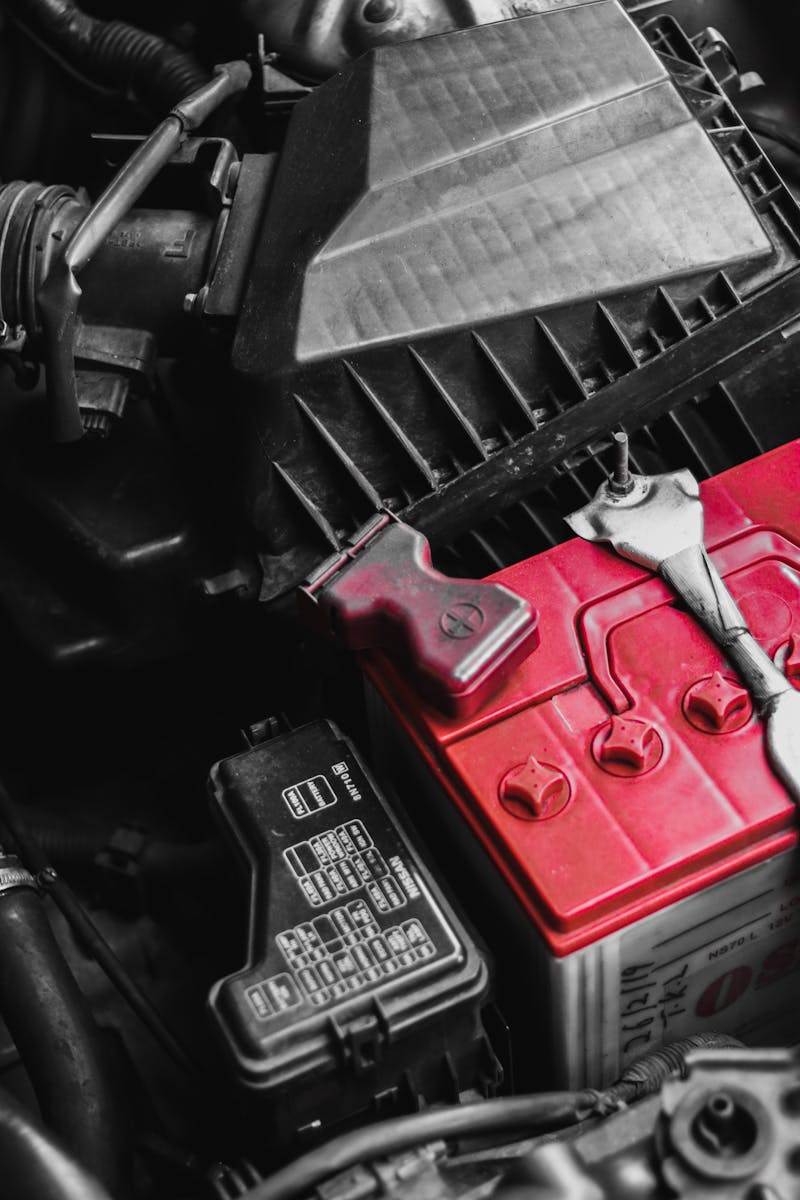 Close-up of a car battery installed in an engine bay — mobile battery replacement in Oklahoma City