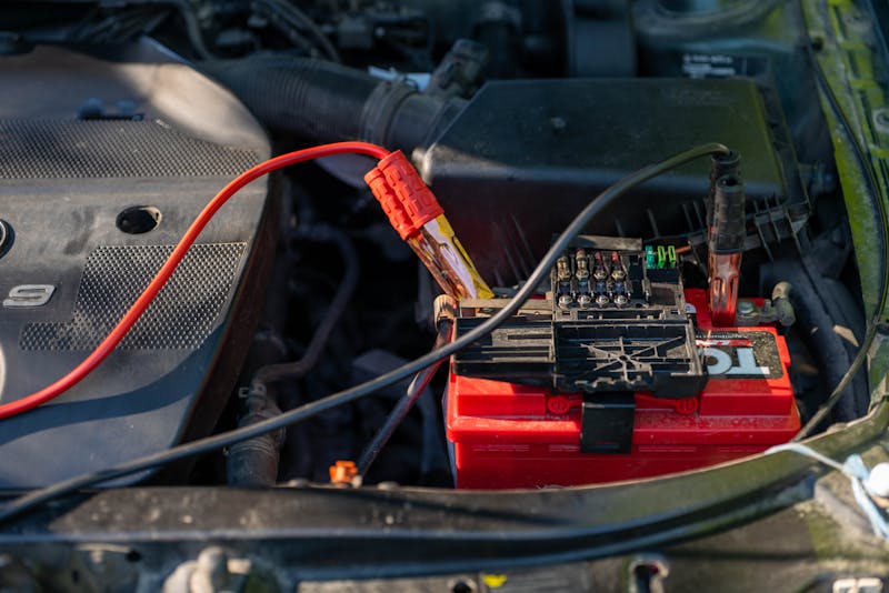 Car battery with jumper cables attached during testing in Oklahoma City